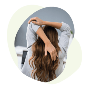 Woman stretching holding elbow above head
